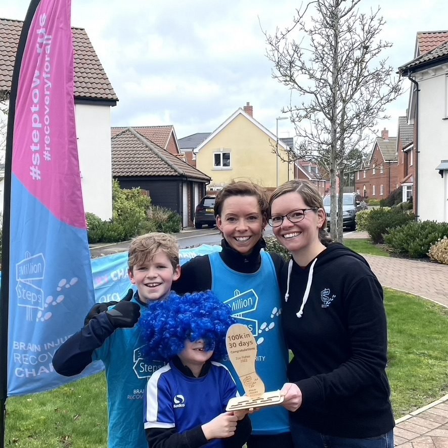 Fundraisers holding a 100k in 30 days trophy