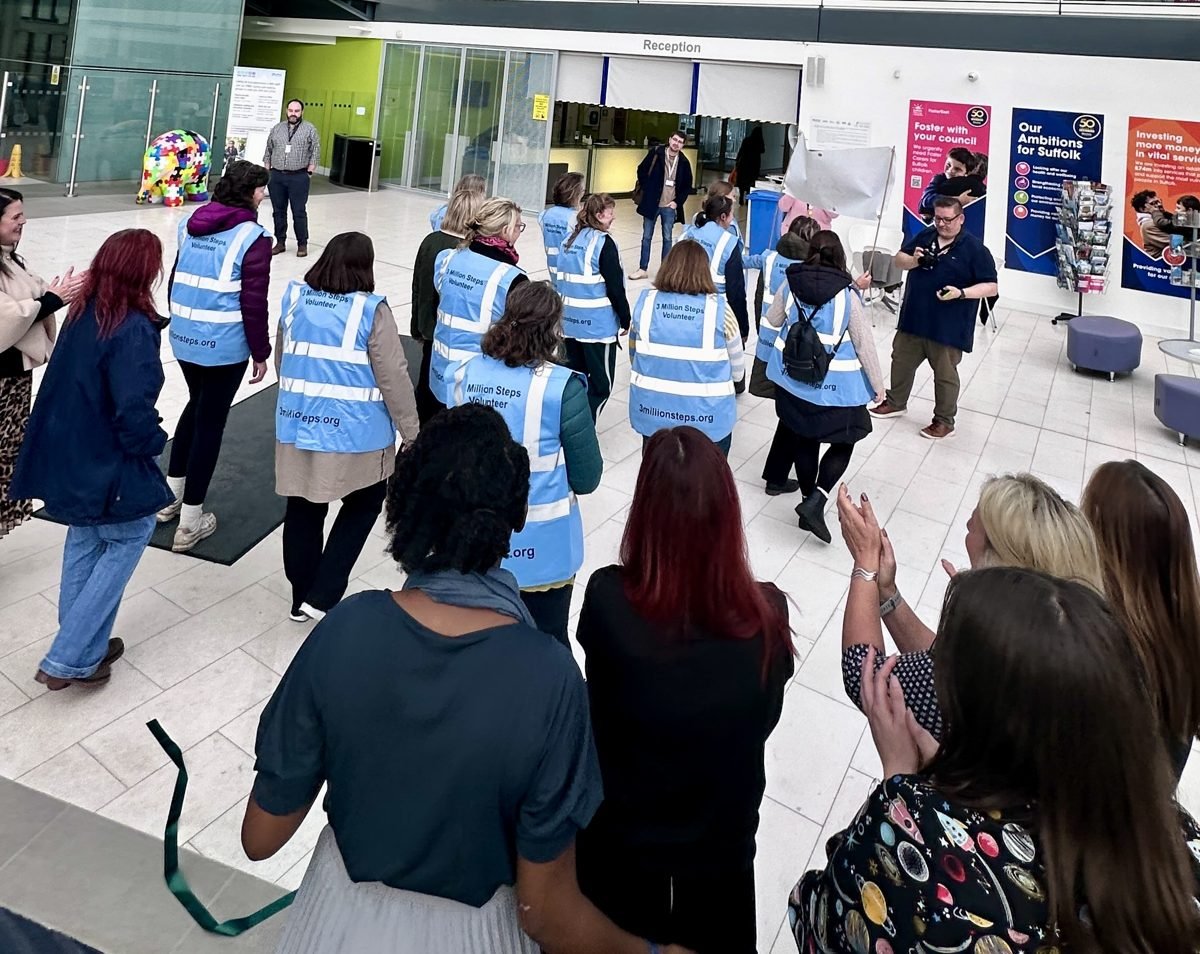 3 Million Steps volunteers walking through a cheering crowd